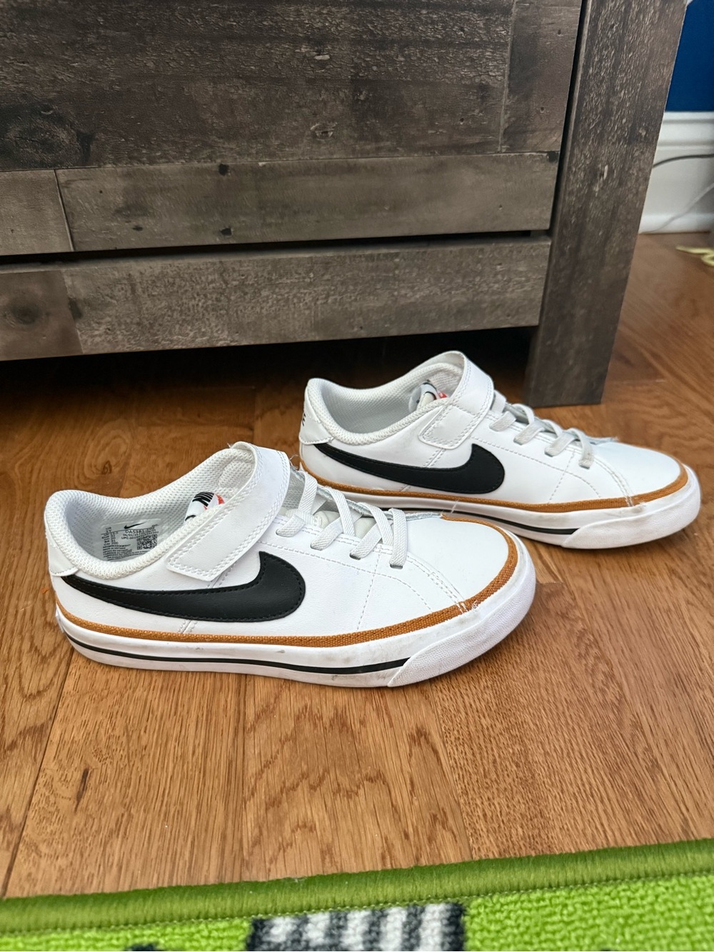 Nike Kids White Sneakers with Black Swoosh and Tan Trim